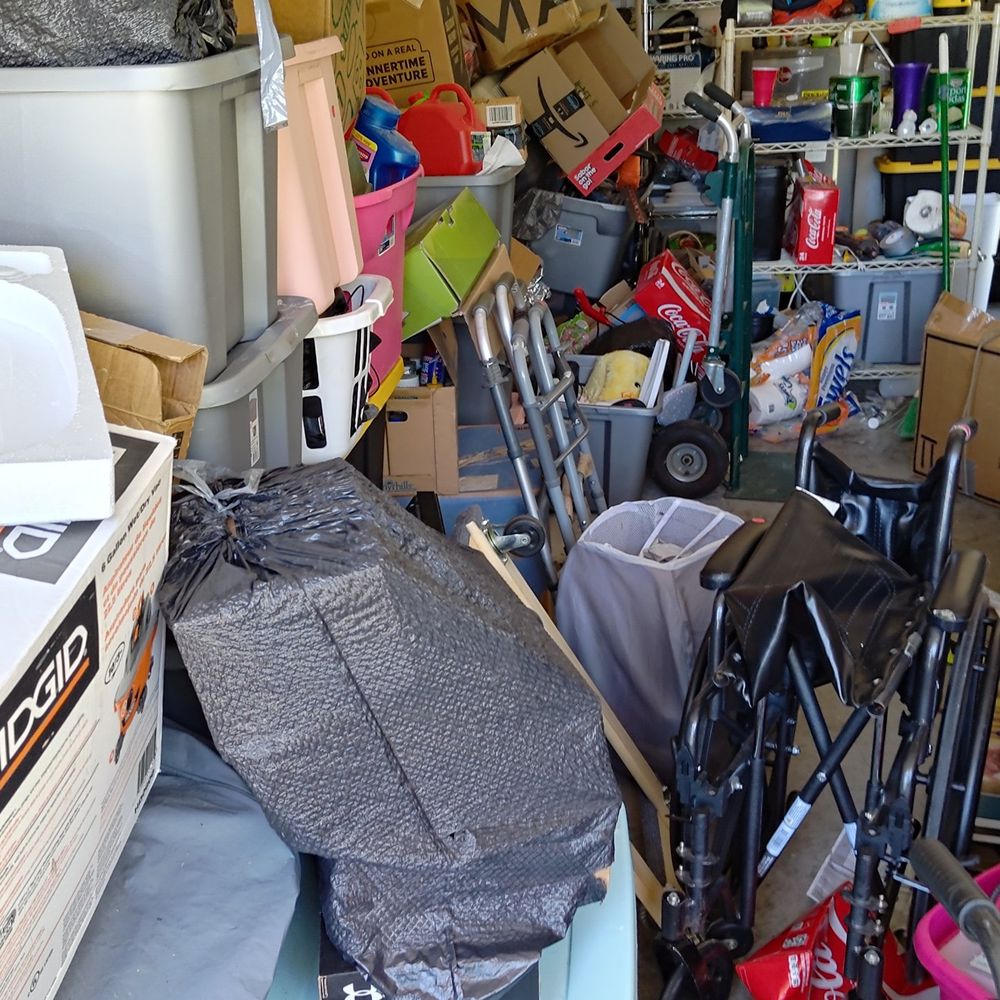 Garage packed with boxes and furniture before cleanout
